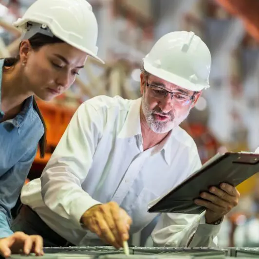 two manufacturers in manufacturing warehouse conducting a predominant use study