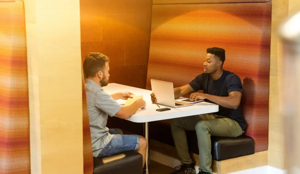 two people working at a booth