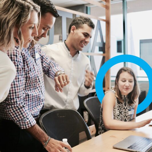 professionals at a desk