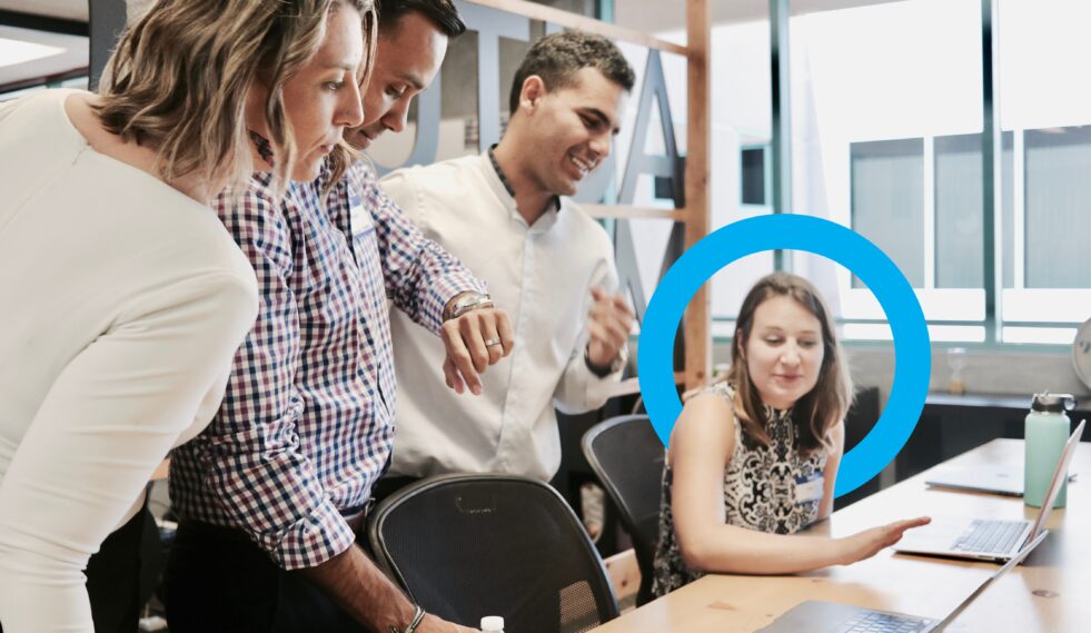 professionals at a desk