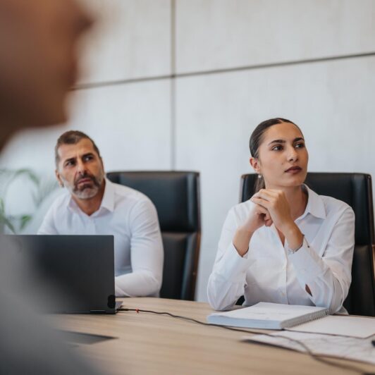 two people focusing during a meeting