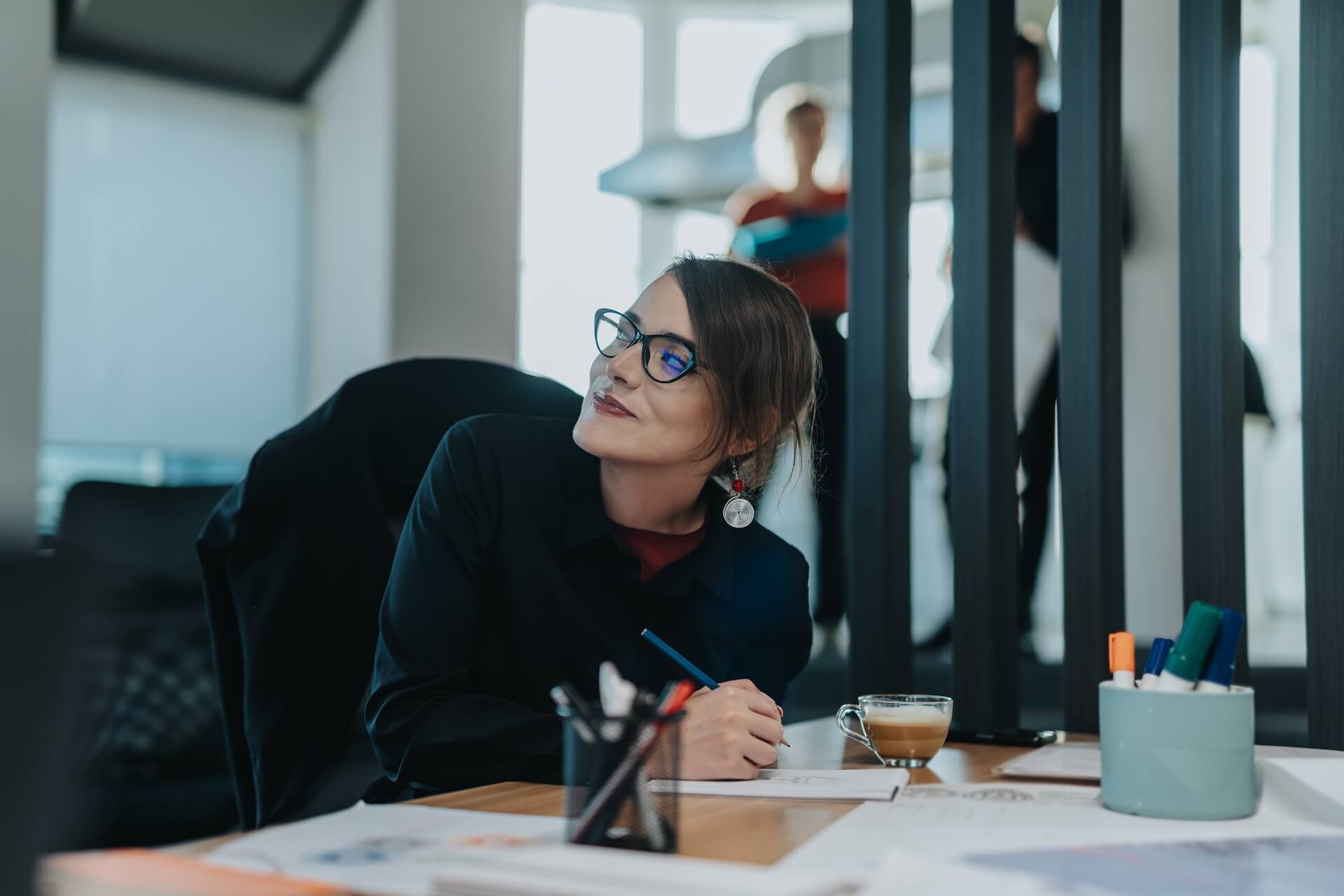 a woman working at her desk