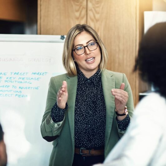 3 people in a small conference room