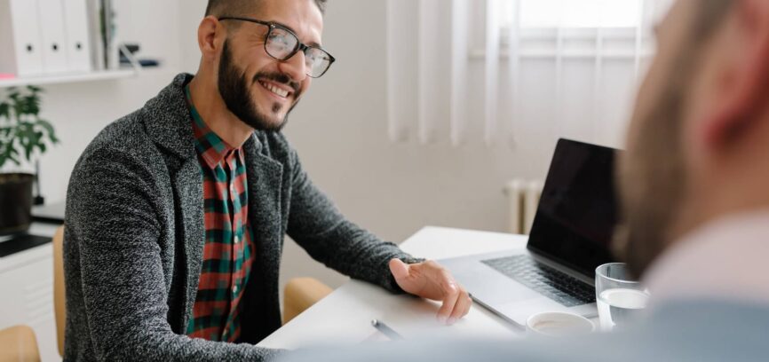 two men in a meeting