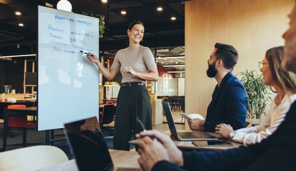 group of people in front of a presenter
