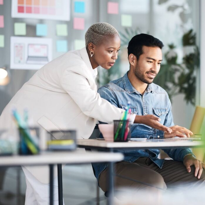 people collaborating at a laptop