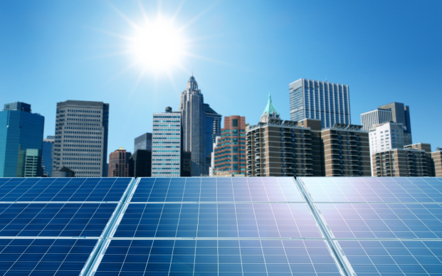 solar panels with a city skyline in the background