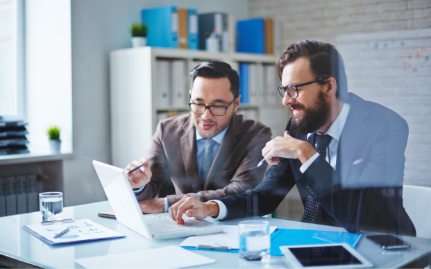 two business professional men having a discussion in an office setting